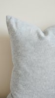 Light gray linen throw pillow with soft texture and neutral tone, ideal for home decor, interior design projects, and residential styling applications.