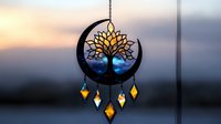 Mystical tree of life dreamcatcher silhouette with glowing crystals against sunset sky, moon crescent design with hanging pendants creates spiritual atmosphere.