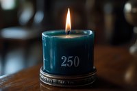 Glowing teal candle with number 250 engraved, burning with warm flame on vintage metal holder against dark wooden surface, creating cozy ambiance.