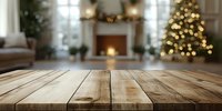 Rustic wooden table surface with blurred festive living room background featuring Christmas tree and fireplace.