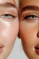 Close-up of two women's faces showing contrasting skin types - one with freckles and fair complexion, other with tanned glowing skin, both with natural makeup looks.