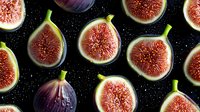Fresh ripe fig halves with bright pink flesh and green stems arranged on black background with water drops, dramatic food photography for menu design.