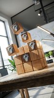 Wooden blocks with lightbulb icons stacked creatively on office desk representing innovation, brainstorming and business idea development in modern workspace.