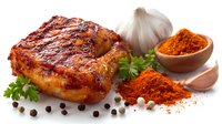 Grilled pork belly with crispy skin served with garlic, paprika powder, parsley, and peppercorns on white background for food photography.