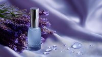 Elegant nail polish bottle with fresh lavender flowers and water drops on silky purple fabric, creating luxurious spa and beauty composition for cosmetic advertising.