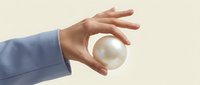 Professional hand in blue sleeve holding glowing white sphere against neutral background symbolizing innovation, energy, and potential in business concept.