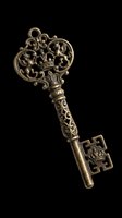 Ornate antique brass skeleton key with intricate filigree detailing, isolated on transparent background. Ready for clipart, t-shirt design, print-on-demand products, stickers, and sublimation projects.
