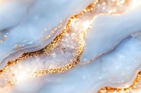 Luxurious white marble texture with gold glitter veins in abstract fluid pattern. Elegant natural stone surface with shimmering metallic details for luxury design.