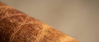 Natural coconut fiber coir material texture close-up showing organic brown fibrous structure for eco-friendly crafts and sustainable products.