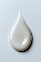 Glossy white cream drop on light background, cosmetic texture with reflective surface and smooth shape for skincare and beauty product advertising.