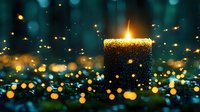 Glowing candle surrounded by magical bokeh lights creating atmospheric mood on dark turquoise background, spiritual meditation concept.