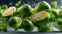 Fresh Brussels sprouts with water droplets in dynamic splash, showcasing both whole and halved vegetables against dark background.