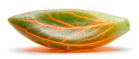 Translucent leaf-shaped resin art object with organic green and orange coloring, isolated on white background, suitable for design projects and decorative applications.