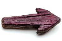 Rustic wooden arrow sign in deep burgundy color with distressed texture and natural wood grain details on white background, isolated for design projects.