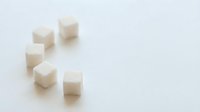 Isolated sugar cubes arranged on white background, ready for food and beverage design, packaging, and culinary content use.
