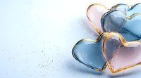 Pink and blue heart shaped decorative elements with golden edges on light background, romantic design elements for valentines and wedding projects.
