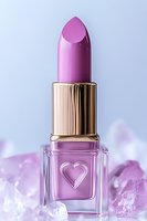 Pink lipstick in glass bottle with heart design and gold cap, surrounded by rose quartz crystals on soft purple background for beauty and cosmetic marketing.