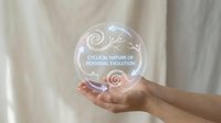 Hands holding transparent sphere with cyclical nature of personal evolution text and spiral symbol representing growth mindset and self-development journey.