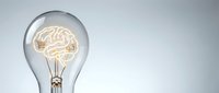 Light bulb with glowing brain filament symbolizing creativity, innovation and bright ideas for business concepts, education and brainstorming solutions.
