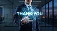 Professional businessman in suit touching holographic thank you text with digital interface effects in modern office environment.