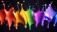 Vibrant rainbow paint splashes and drops on black background, dynamic liquid motion with red, orange, yellow, green, pink, purple and blue colors creating artistic pattern.
