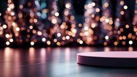 Round podium display on reflective surface with blurred bokeh lights background in warm orange and purple tones creates magical atmosphere for product presentation.