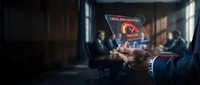 Businessman presenting holographic data security interface in modern corporate boardroom meeting with colleagues analyzing cybersecurity solutions.