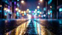 Wet asphalt road at night with colorful bokeh lights creating atmospheric urban scene for backgrounds and mood lighting concepts.