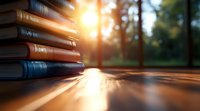 Stack of old books on wooden table with sunlight streaming through forest trees, creating atmospheric golden hour lighting and long shadows.