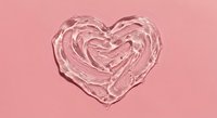 Clear glass heart-shaped bowl with swirled pattern on pink background for romantic decor, Valentine's Day gifts, love concepts, and wedding designs.