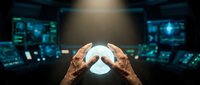 Man holding glowing orb in futuristic tech environment with digital screens and data displays, representing innovation, technology prediction, and digital transformation.