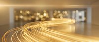 Golden light trails flowing in curved motion across modern interior space with warm bokeh background creating dynamic energy and movement concept.