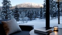 Cozy winter evening view through panoramic window with cushions and candle, overlooking snow-covered pine forest and mountain landscape at dusk.