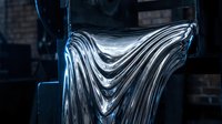 Molten liquid metal flowing with shiny chrome texture, dramatic industrial close-up with dark background, metallic waves and reflections.