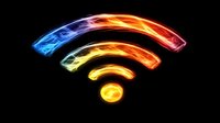 Glowing multicolored wifi symbol on black background shows wireless internet connection concept with neon light effect, suitable for technology designs.