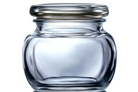 Empty glass jar with metal lid on white background, clear container with rounded shape and screw-top closure, isolated product photography for packaging design.