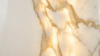 Elegant white marble surface with golden veins and natural stone texture for luxury interior design and architectural applications.