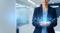 Professional businesswoman in navy suit holding glowing digital network connections in modern office environment for technology and innovation concepts.