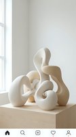 Modern abstract sculpture with flowing organic curves in cream white ceramic displayed on wooden pedestal near window in minimalist interior space.