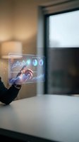 Businessperson holding holographic display with financial charts and analytics data. Modern office setting with window background. Technology and data visualization concept for business solutions.