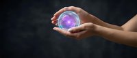 Hands holding glowing purple energy orb with magical light effects against dark background for fantasy and mystical design concepts.