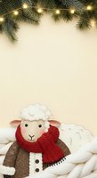 Cute sheep character wearing red knit scarf and brown coat sits among fluffy clouds below evergreen branches with warm string lights, ideal for holiday greeting cards and seasonal marketing materials.