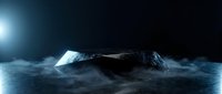 Dark stone podium on smoky ground with dramatic blue light, futuristic product display stage for luxury showcase presentation.