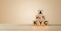 Wooden blocks spelling KYC with business icons stacked in pyramid formation on neutral background for compliance and verification concepts.