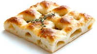 Golden focaccia bread with fresh thyme sprig on white background, featuring airy texture and crispy top for food photography and culinary presentations.