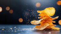 Golden crispy potato chips falling and stacking with salt crystals scattered around on dark background with warm bokeh lights for snack food advertising.