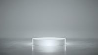 White cylindrical podium platform on gray gradient background with soft lighting for product display and presentation purposes.