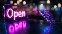 Glowing pink neon open sign with reflection on dark surface and magical sparkle trail effect, creating modern night business atmosphere with bokeh background.