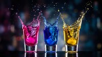 Colorful liquid splash in three glasses with pink blue yellow drinks creating dynamic motion against dark bokeh background for beverage advertising concepts.