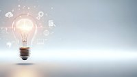 Glowing light bulb with digital technology icons and network connections on clean white background representing innovation and creative ideas.